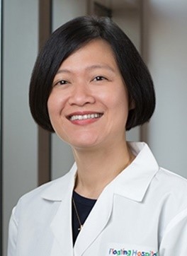 A person in a white lab coatDescription automatically generated